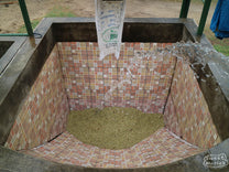 Adding water to the tiled fermentation tank at the Buenos Aires mill.